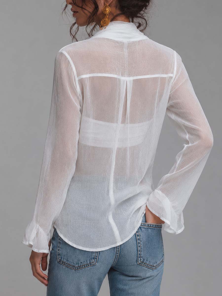 Blusa de gasa semitransparente arrugada con frente cruzado, lazo anudado, mangas largas y camisola