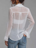 Blusa de gasa semitransparente arrugada con frente cruzado, lazo anudado, mangas largas y camisola